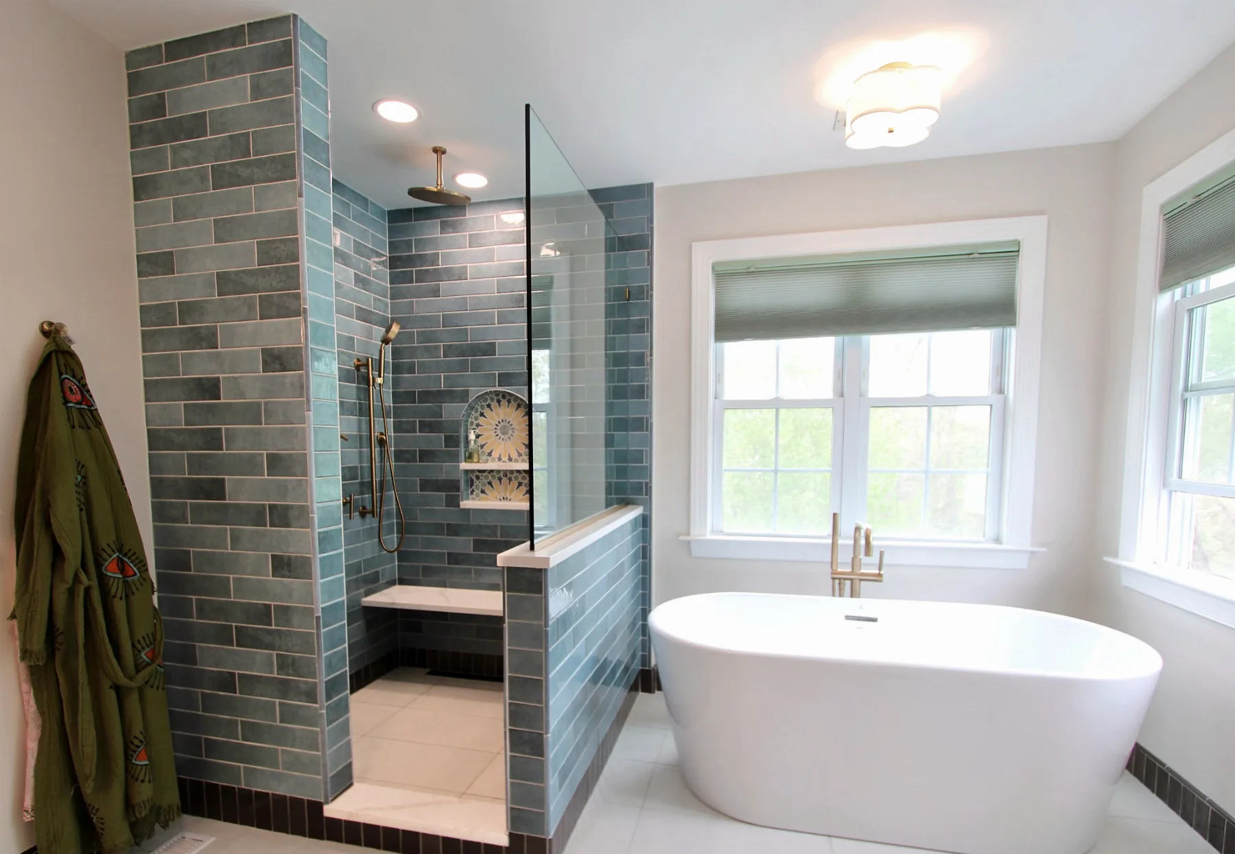 Doylestown primary bathroom with shower, soaking tub, windows and brass fixtures.