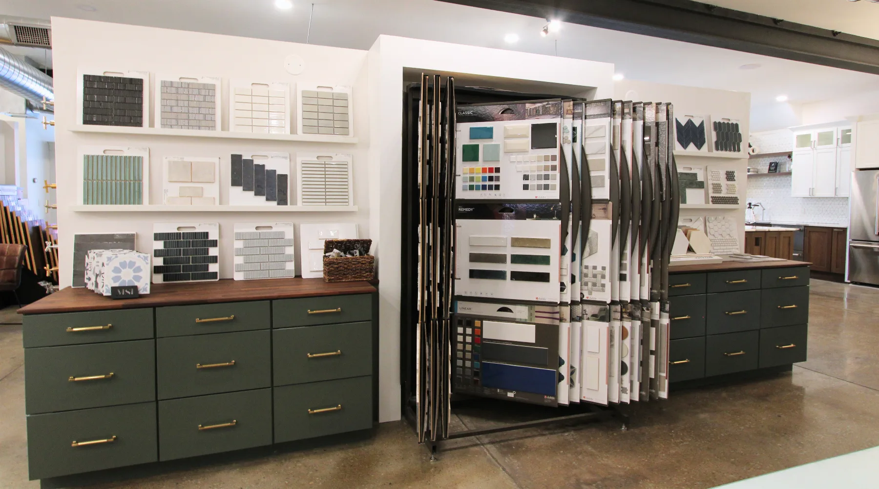 Cabinetry and finish material samples on the showroom wall